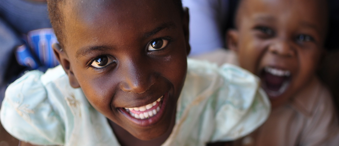 Photograph of a smiling girl in Kenya